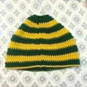 Green and gold (Green Bay Packers colors) knitted beanie with pony tail insert